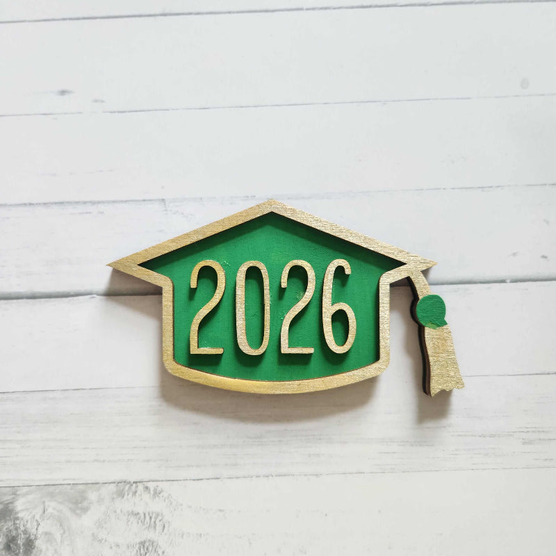 Decorative item with '2026' on a green and beige background