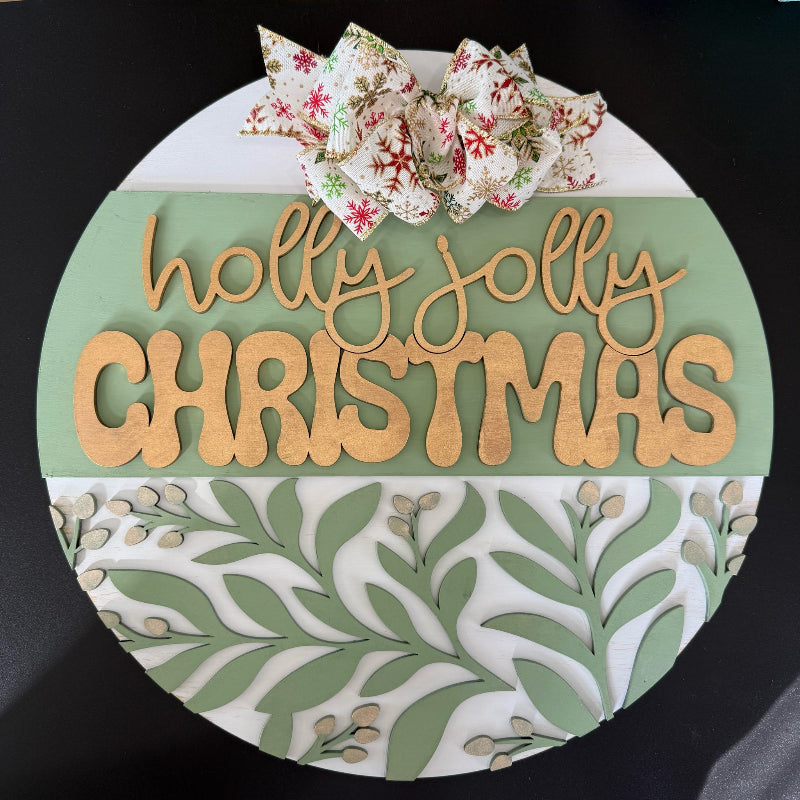 Decorative sign with 'holly jolly Christmas' text and floral design on a black background