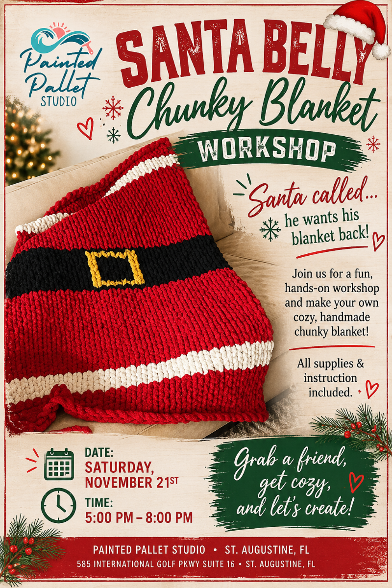 Handmade Santa Belly chunky knit blanket featuring bright red yarn, a black belt with a gold buckle, and white trim. This festive Christmas blanket is the featured project for a holiday chunky blanket workshop at Painted Pallet Studio in St. Augustine, FL, where participants learn to hand-knit their own cozy holiday blanket without needles.