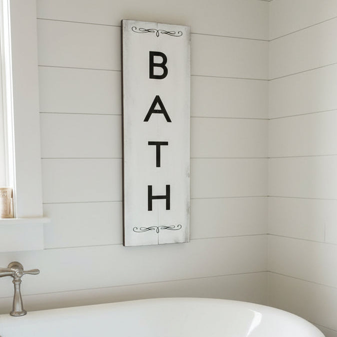 White sign with the BATH written vertically in black