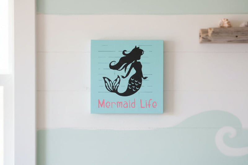A mermaid with the words Mermaid Life on a square sign