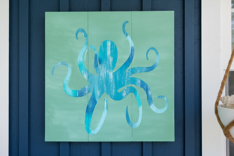 colorful octopus set on a green wooden background