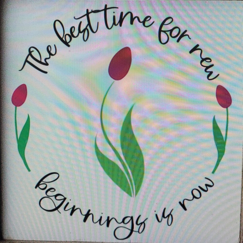 A square design featuring the text 'THE BEST TIME FOR NEW BEGINNINGS IS NOW' surrounded by a green and purple tulip illustration, indicating a theme of inspiration and new beginnings.