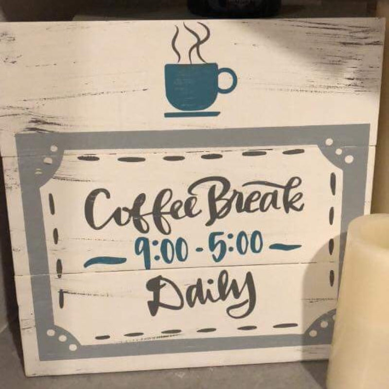 A square wooden sign with a white background featuring a gray cup of coffee and the text 'COFFEE BREAK 9:00 - 5:00 DAILY', with a stylized design of a coffee mug and melted coffee.