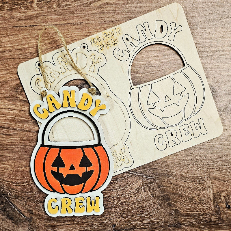 Halloween-themed 'Candy Crew' candy holder on a wooden surface