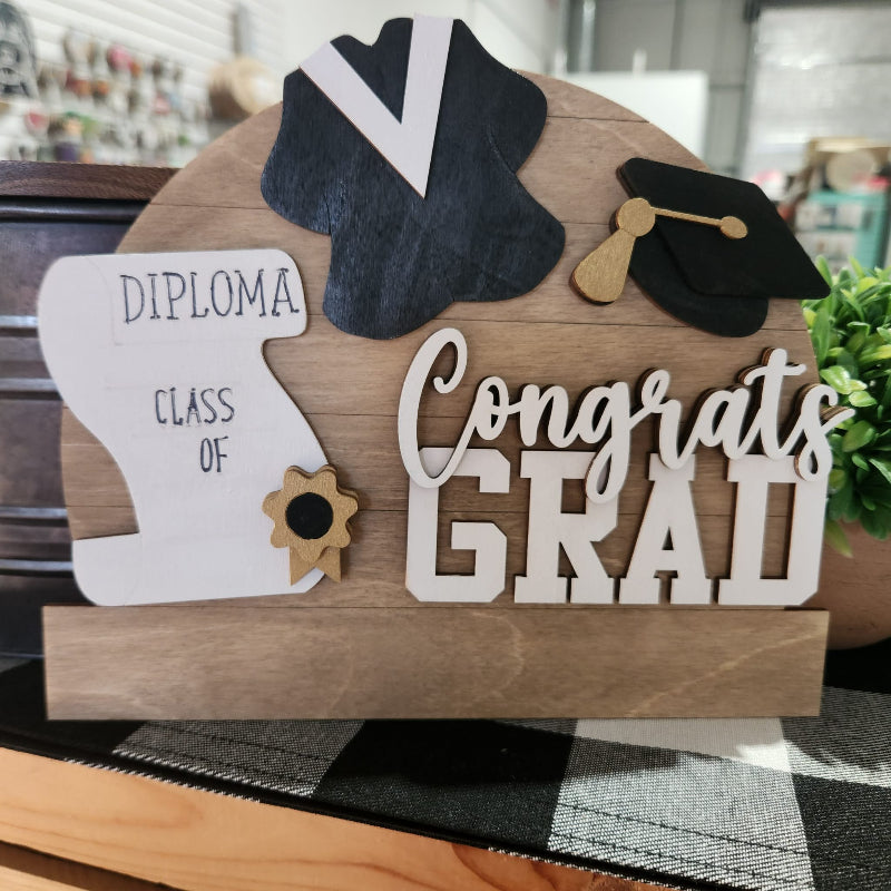 Graduation-themed wooden sign with mortarboard, diploma, and 'Congrats Grad' text.