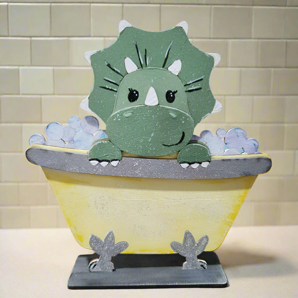 Wooden dinosaur toy with a bathtub on a wooden surface
