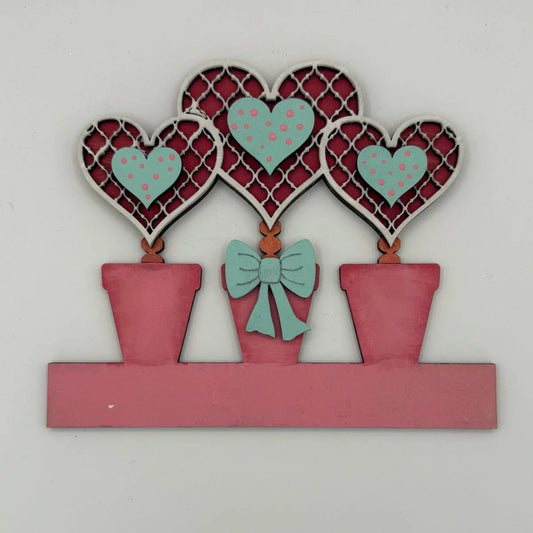 Heart topiary trio wooden dropin set on a white background