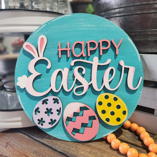 Round wooden sign with 'Happy Easter' text and decorative eggs on a rustic background.