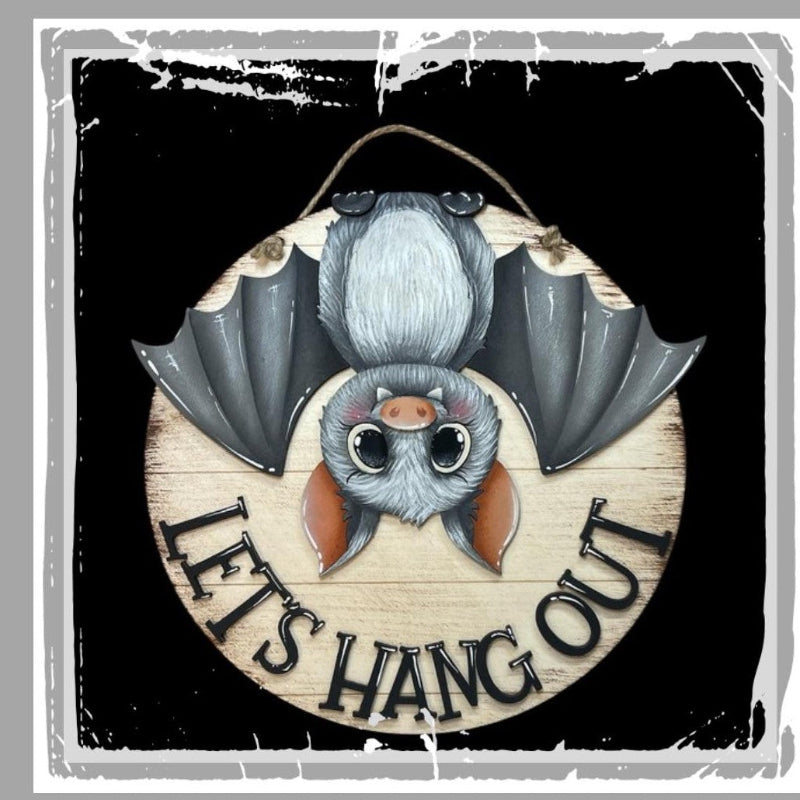 Illustration of a bat with a circular sign that says 'Let's Hang Out' on a dark background.