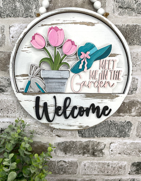 Meet Me in the Garden spring interchangeable wooden Welcome sign insert with pink tulips, garden tools, flowerpot and teal garden hat.