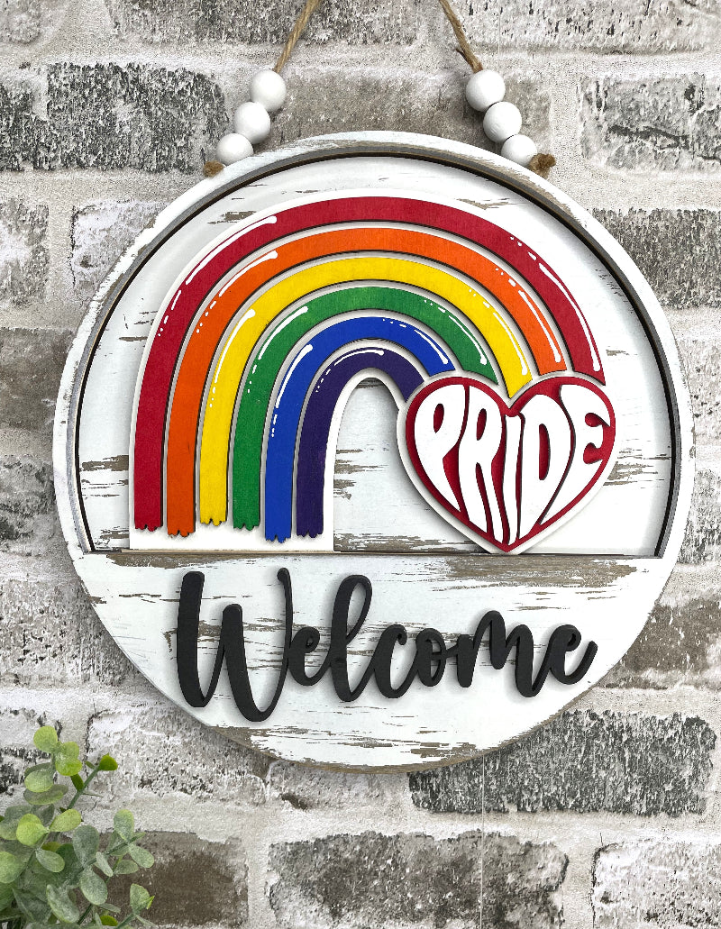 Pride Rainbow interchangeable wooden Welcome sign insert featuring a colorful layered rainbow and red heart with retro PRIDE lettering.