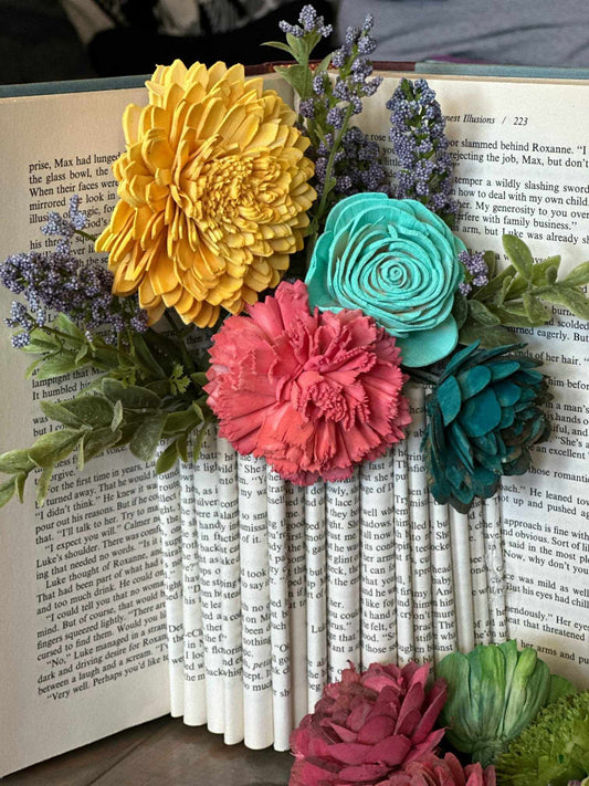 Colorful flower arrangement on an open book