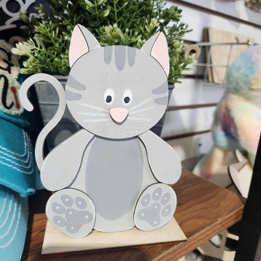 wooden kitty that sits on a grooved base. approx 7 inches in height. great for a diy kit. perfect for all ages