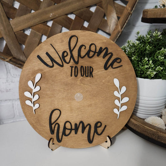 round wooden sign that says Welcome to our Home