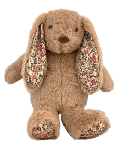 Plush bunny toy with floral ears on a white background
