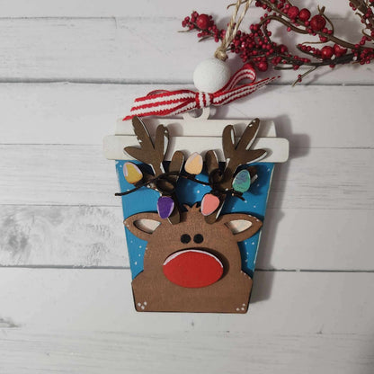 reindeer ornament with lights strung across antlers
