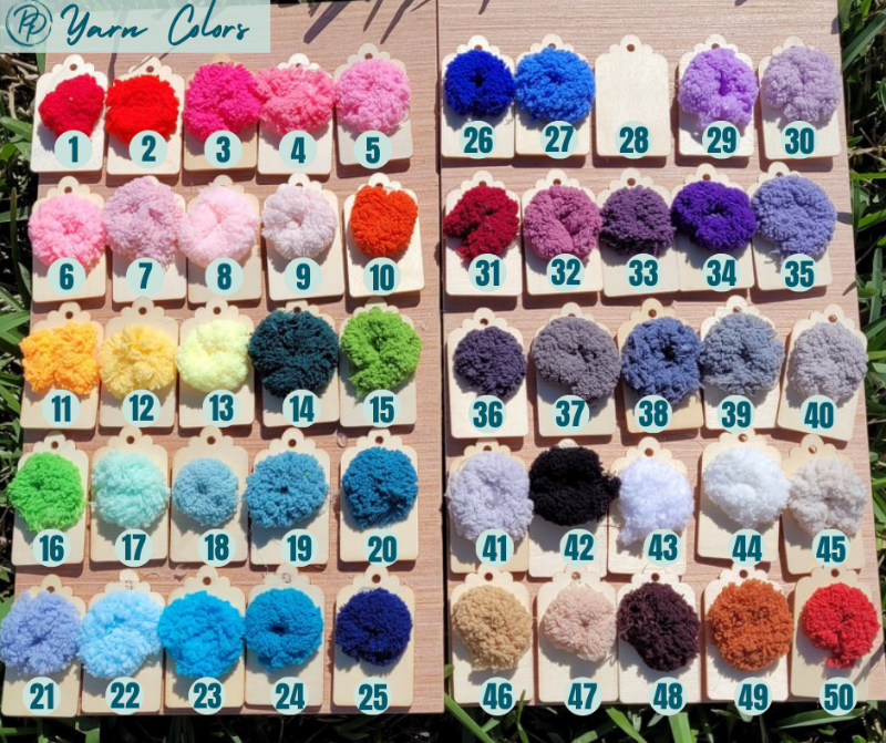 Yarn color swatches displayed on a wooden board with numbers