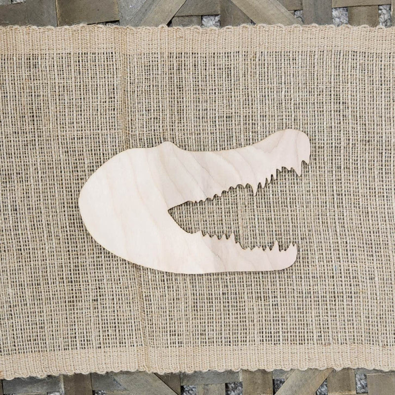A wooden cutout in the shape of an aligator head