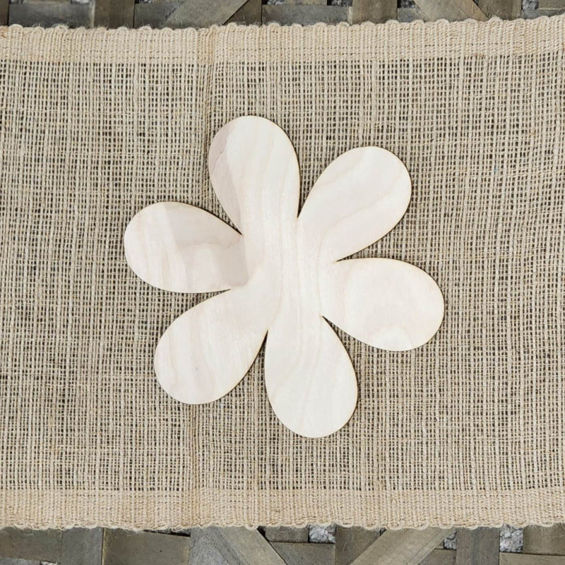 A wooden cutout in the shape of an flower