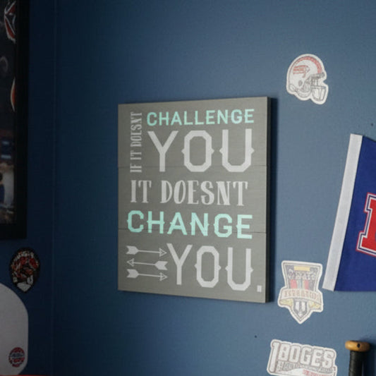 motivational quote on a gray background. if it doesn't callenge you if doesn't change you
